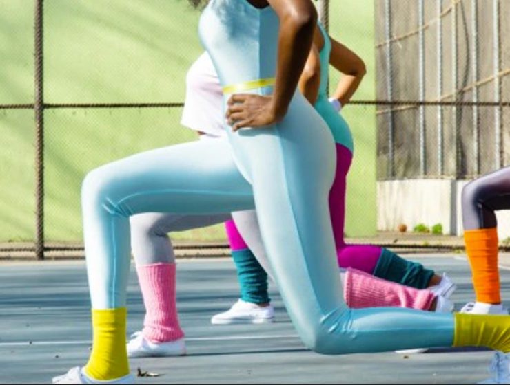 women doing lunges during group workout