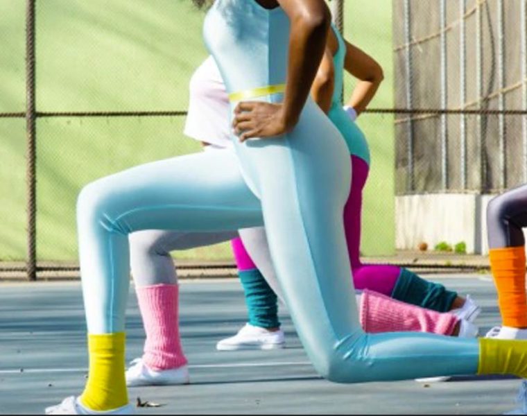 women doing lunges during group workout